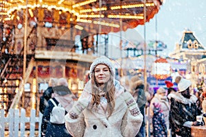 Girl walking on Christmas Market on Red Square in Moscow