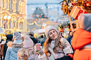 Girl walking on Christmas Market on Red Square in Moscow