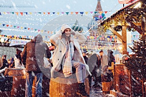 Girl walking on Christmas Market on Red Square in Moscow