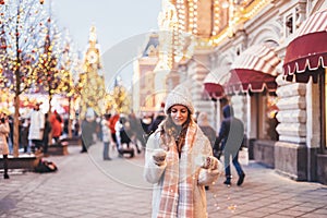 Girl walking on Christmas Market on Red Square in Moscow