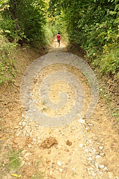 Girl walking on a countryside road