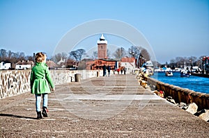 Girl walking on Darlowo jetty