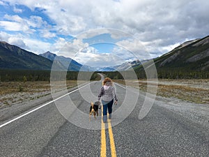 Girl Walking Dog on the Alaska Canada Highway
