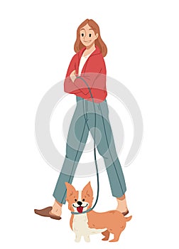 Girl walking with dog on a leash. Welsh Corgi.