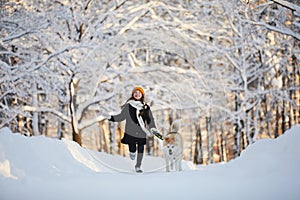 Girl Walking Dog in Winter Park