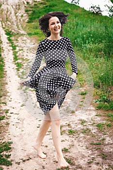 Girl walking down along the path