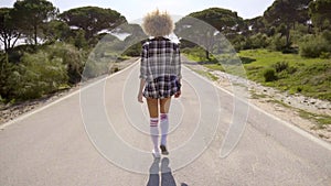 Girl Walking Down The Country Road