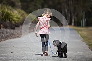 Girl Walking Her Dog