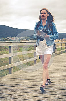 Girl walking with his camera