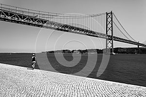 Girl walking near the Vasco Da Gama bridge