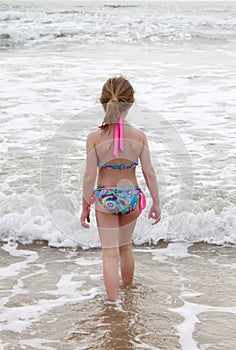 Girl Walking into Ocean
