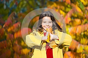 Girl walking in park sunny day. Enjoy moment. Autumn warm. Leaf fall. Stylish girl in autumn coat walking in autumn park