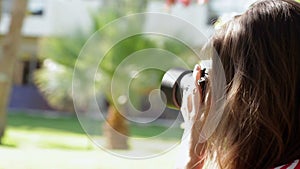 Girl walking in the park and take pictures