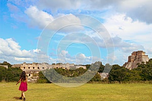 Girl walking in ruins of the ancient city in Uxmal, Yucatan, Mexico