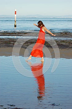 Girl walking in shallow water