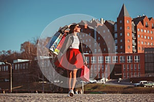 The girl walking with shopping on city streets