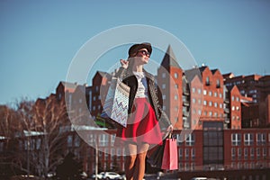 The girl walking with shopping on city streets