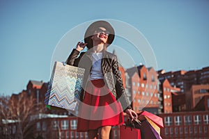 The girl walking with shopping on city streets