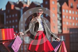 The girl walking with shopping on city streets