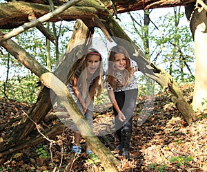 Girl walking under fallen trunk