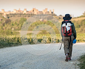 Girl walking on Via Francigena photo