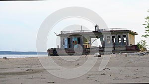 A girl walks along an abandoned landing stage