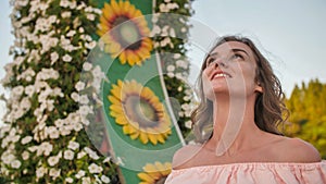 A girl walks through a beautiful fairytale park in Dubai.