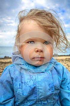 Girl walks by the sea