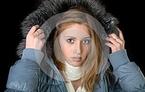 The girl in warm jacket with a hood