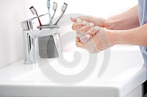 Girl Washes Hands With Liquid Soap