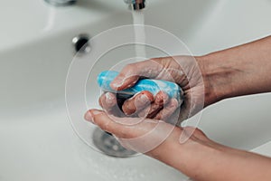 The Girl Washes Her Hands to Avoid Infection With the Virus COVID-19