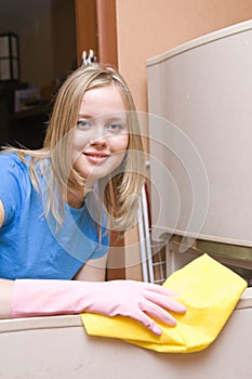 Girl washes refrigerator