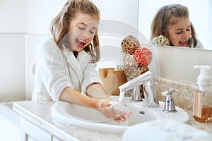 Girl is washing hands