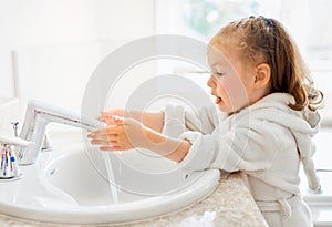 Girl is washing hands