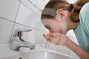 Girl Washing Mouth