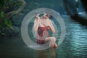 Girl washing in streams.
