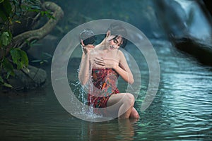 Girl washing in streams.