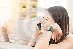 Girl with watch and phone with blank screen