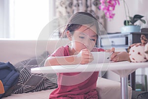 Girl watching online video on cellphone