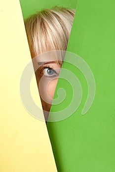 Girl watching out from a colorful surrounding