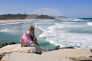 Girl watching surfers