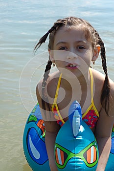 Girl with water float toy