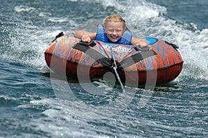 Girl Water Tubing with a Smile photo