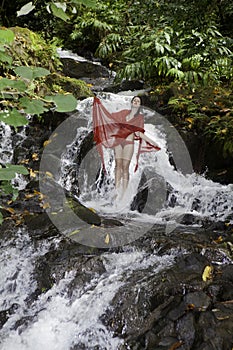 Girl in a waterfall