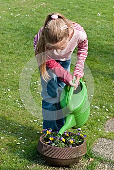 Girl watering flowers