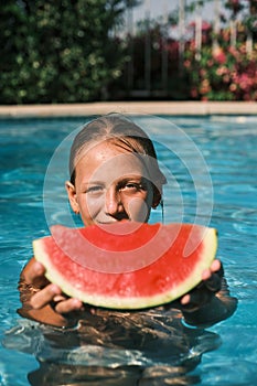 girl with watermelon inside the pool