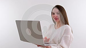 girl waving at laptop camera talking with grandparents with loved ones on white background space for text social
