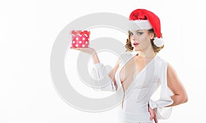 Girl wear santa claus hat. Gift from santa. Woman attractive lady wear sexy dress and santa hat. Girl hold cute box