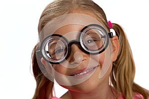 Girl wearing big round glasses