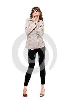 Girl wearing a coat and black leggings. Isolated